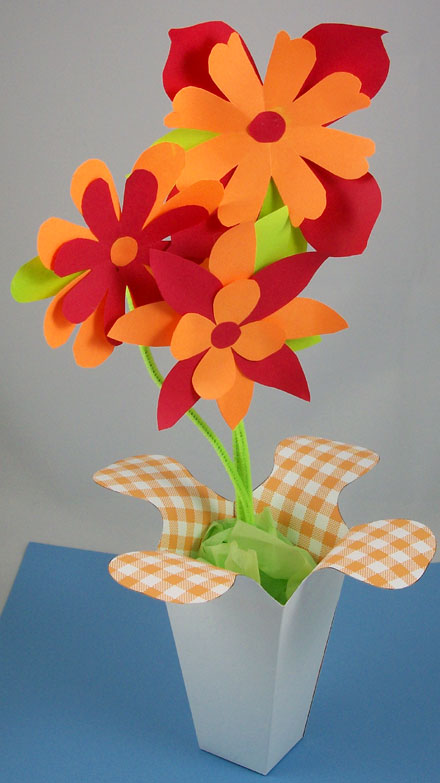 Flared box used as a vase for paper flowers