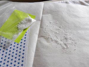 Sprinkle wax on parchment paper