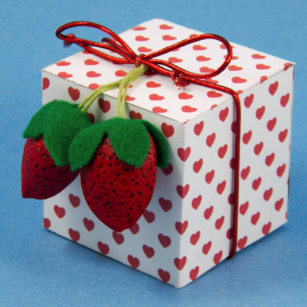 Almond strawberries decorating a gift box