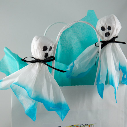Blue tissue ghosts used to decorate a gift bag