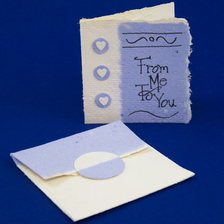 Example enclosure card and envelope made from handmade paper with a contrasting border